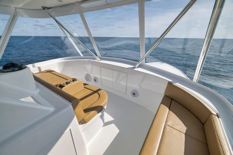 Pistol Yacht Photos Pics Luxurious Weaver 60 Convertible yacht interior, 2002 model, with ocean view and tan seating.