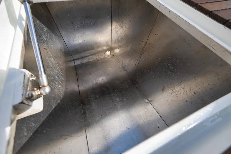 Pistol Yacht Photos Pics Stainless steel compartment in 2002 Weaver 60 Convertible boat, open lid view.