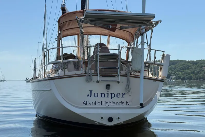 Juniper Yacht Photos Pics Island Packet 420 sailboat named Juniper, docked in calm waters, Atlantic Highlands, NJ.