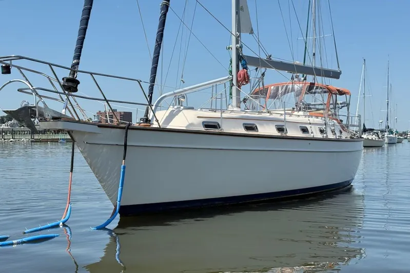 Juniper Yacht Photos Pics Island Packet 420 sailboat, 2002 model, docked in calm marina waters.