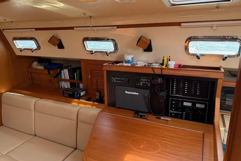 Juniper Yacht Photos Pics Interior of 2002 Island Packet 420 yacht with navigation equipment and seating area.