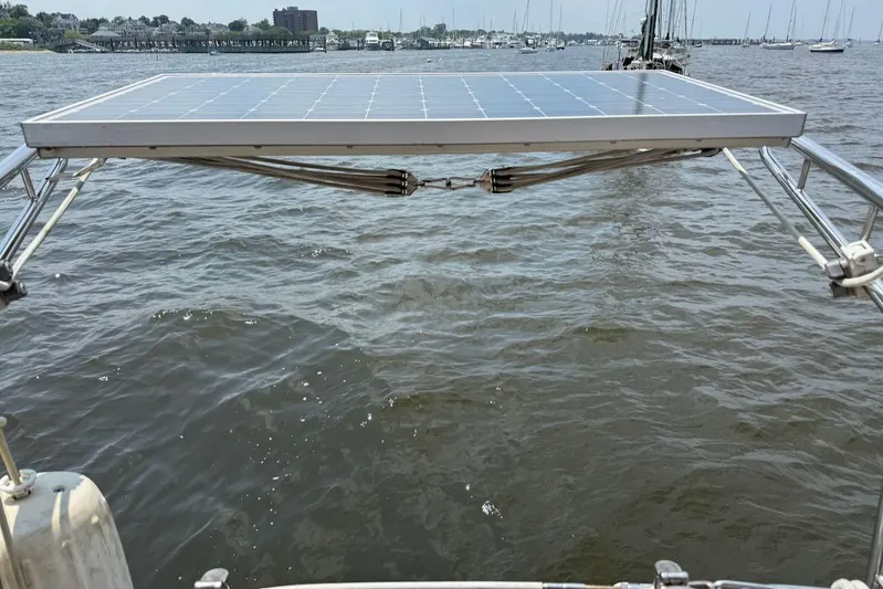 Juniper Yacht Photos Pics Solar panel on Island Packet 420 sailboat, 2002 model, over water.