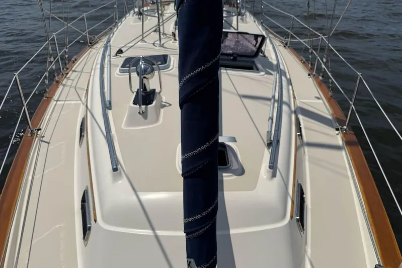 Juniper Yacht Photos Pics Deck view of 2002 Island Packet 420 sailboat, featuring sleek design and polished wood accents.