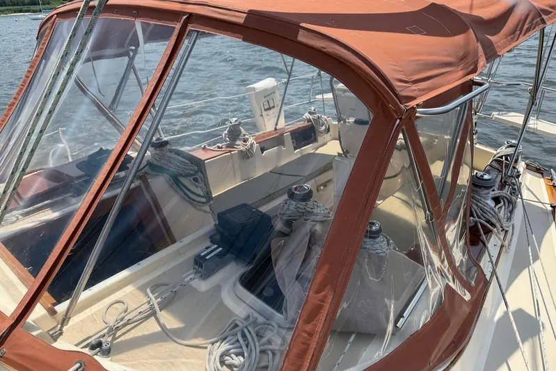 Juniper Yacht Photos Pics Island Packet 420 sailboat cockpit with brown canopy, ropes, and winches, 2002 model.