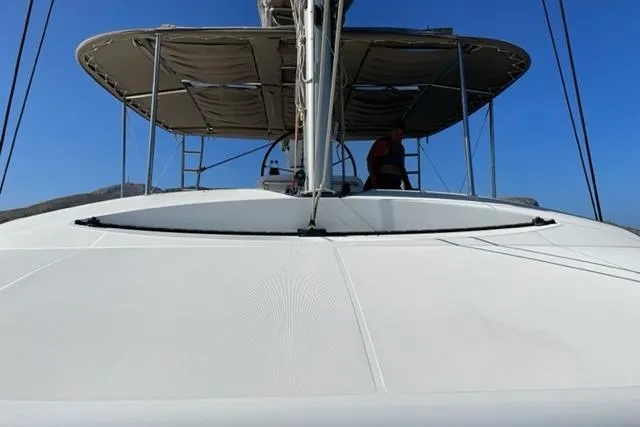 Mojito Yacht Photos Pics 2016 Lagoon 52 F catamaran deck with canopy under clear blue sky.