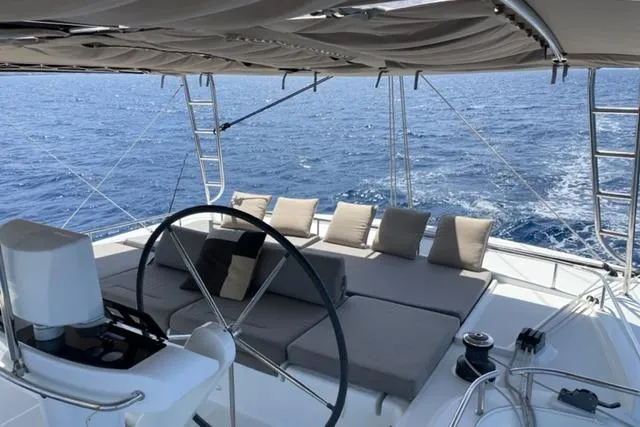 Mojito Yacht Photos Pics Luxurious 2016 Lagoon 52 F yacht deck with seating, ocean view, and helm.