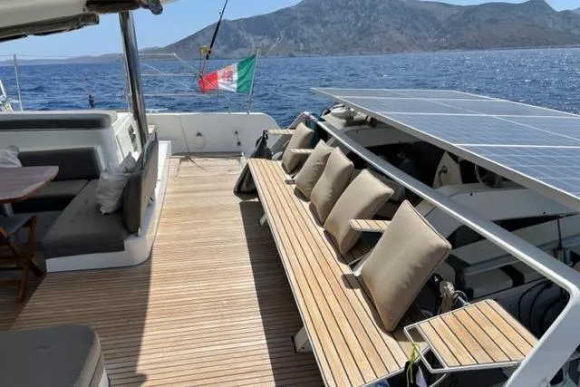 Mojito Yacht Photos Pics Luxurious 2016 Lagoon 52 F yacht deck with seating, cushions, and ocean view.