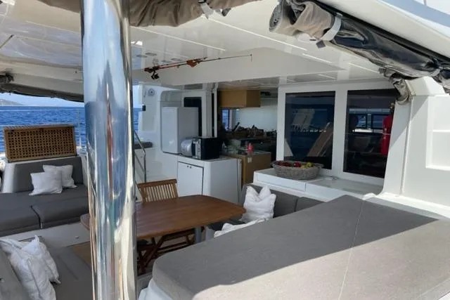 Mojito Yacht Photos Pics Luxurious interior of 2016 Lagoon 52 F catamaran with seating and dining area.