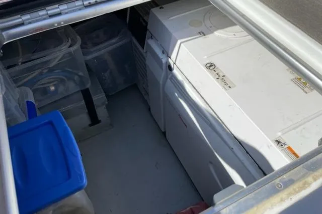 Mojito Yacht Photos Pics Storage compartment on a 2016 Lagoon 52 F yacht with organized containers and equipment.