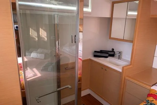 Mojito Yacht Photos Pics Luxurious interior of 2016 Lagoon 52 F yacht featuring modern bathroom and sleek design.