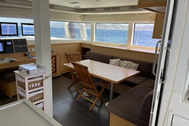 Mojito Yacht Photos Pics Interior of 2016 Lagoon 52 F yacht with dining area and ocean view.