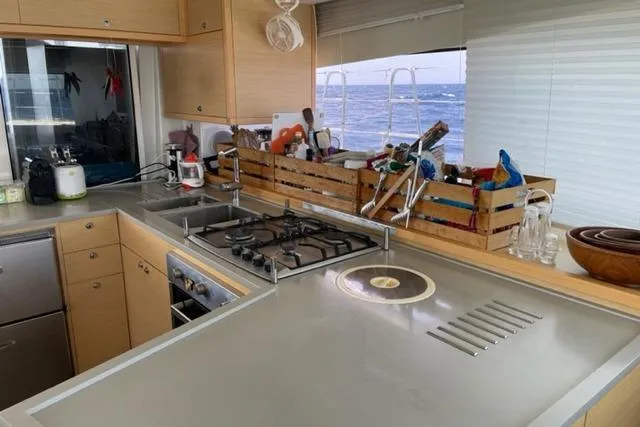 Mojito Yacht Photos Pics Modern kitchen interior on 2016 Lagoon 52 F yacht with ocean view.