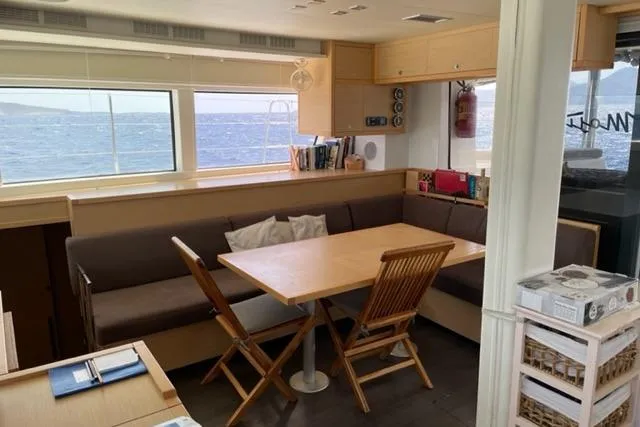Mojito Yacht Photos Pics Interior of 2016 Lagoon 52 F yacht with dining area and ocean view.