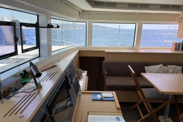 Mojito Yacht Photos Pics Interior of 2016 Lagoon 52 F yacht with ocean view through large windows.