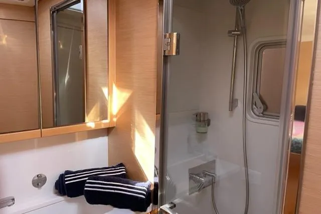 Mojito Yacht Photos Pics Luxurious bathroom interior of 2016 Lagoon 52 F yacht with shower and towels.
