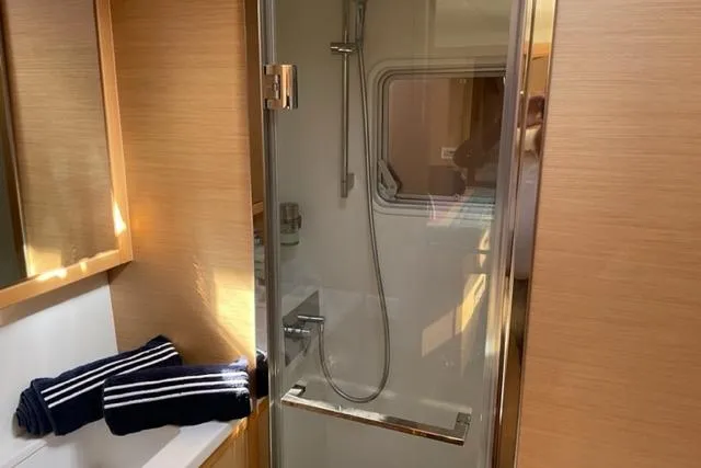 Mojito Yacht Photos Pics Luxurious bathroom in 2016 Lagoon 52 F yacht with modern shower and towels.