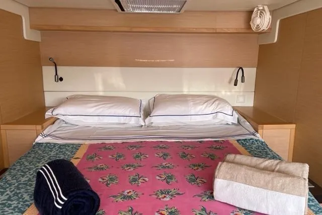 Mojito Yacht Photos Pics Luxurious cabin interior of 2016 Lagoon 52 F yacht with neatly arranged bedding.