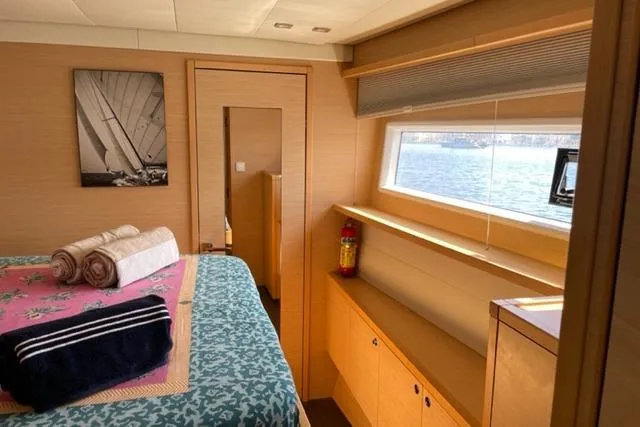 Mojito Yacht Photos Pics Luxurious interior of 2016 Lagoon 52 F yacht cabin with bed, window view, and decor.