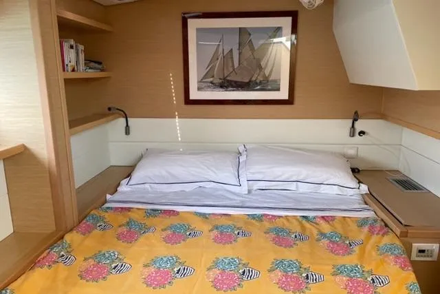 Mojito Yacht Photos Pics Cozy bedroom in 2016 Lagoon 52 F yacht with nautical decor and vibrant bedding.