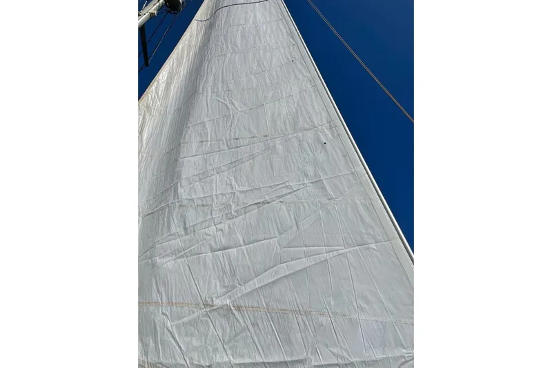 Mojito Yacht Photos Pics Sail of 2016 Lagoon 52 F catamaran against clear blue sky.