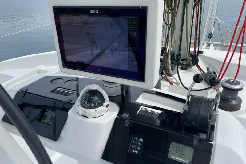 Mojito Yacht Photos Pics Helm station of 2016 Lagoon 52 F catamaran with navigation equipment and compass.