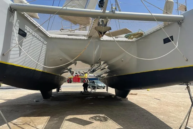 Mojito Yacht Photos Pics 2016 Lagoon 52 F catamaran on dry dock, showcasing hull and underbody details.