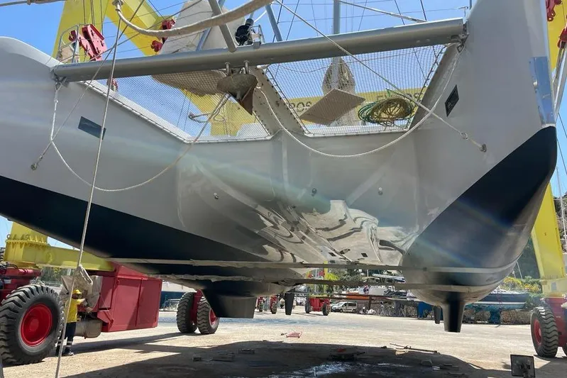 Mojito Yacht Photos Pics 2016 Lagoon 52 F catamaran on land, showcasing hull and underbody details.