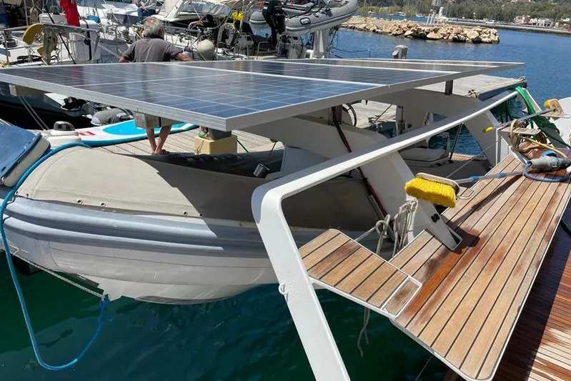 Mojito Yacht Photos Pics 2016 Lagoon 52 F catamaran with solar panels and wooden deck at marina.
