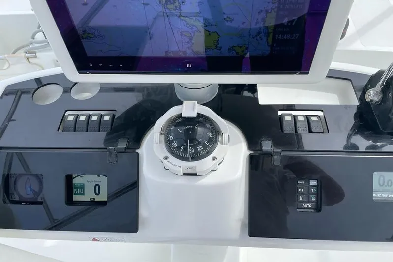 Mojito Yacht Photos Pics Control panel of a 2016 Lagoon 52 F yacht with navigation instruments.
