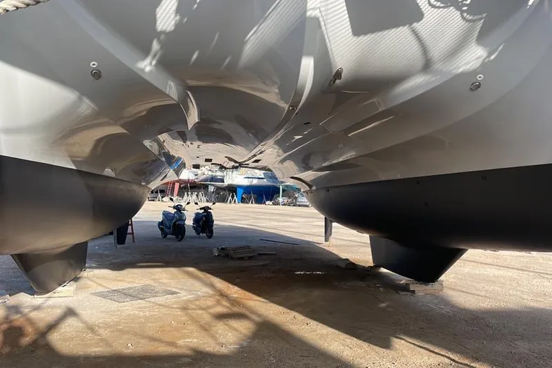 Mojito Yacht Photos Pics Underneath view of a 2016 Lagoon 52 F catamaran in a boatyard.