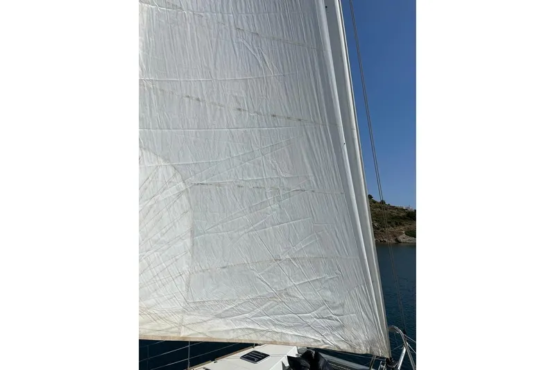 Mojito Yacht Photos Pics Sail of a 2016 Lagoon 52 F catamaran against a clear blue sky.