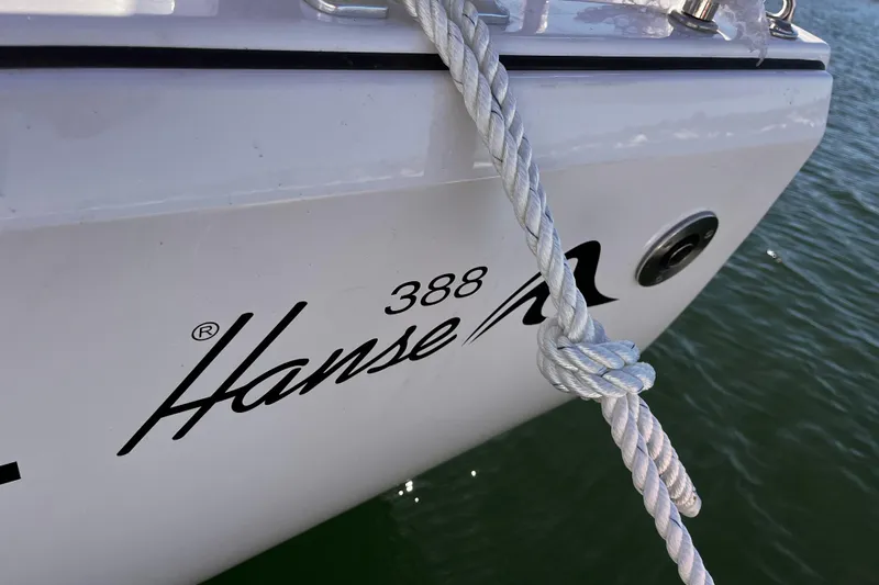 Mdr 388 #305 In Stock Yacht Photos Pics Close-up of 2023 Hanse 388 yacht with rope tied to the side.