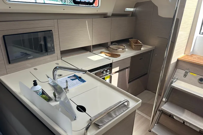 Mdr 388 #305 In Stock Yacht Photos Pics Modern kitchen interior of 2023 Hanse 388 yacht with sleek design and appliances.