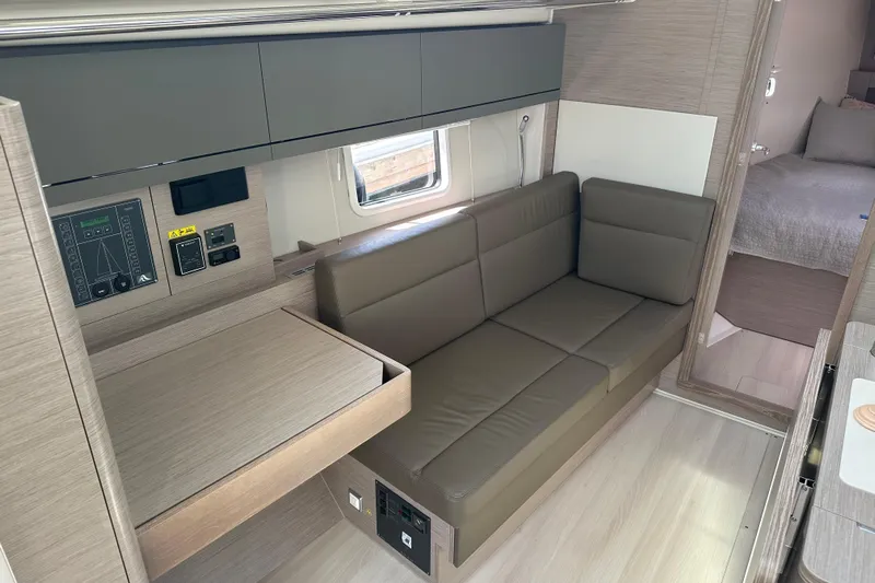 Mdr 388 #305 In Stock Yacht Photos Pics Modern interior of 2023 Hanse 388 yacht with sleek sofa and control panel.