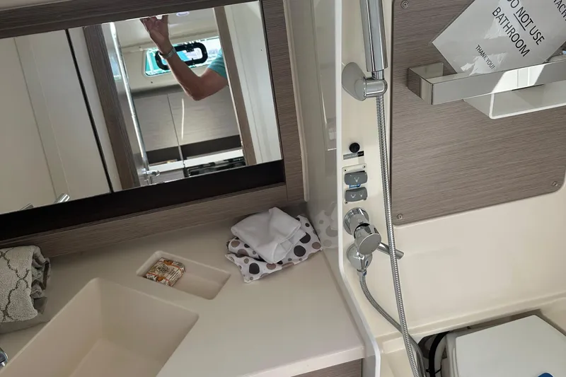 Mdr 388 #305 In Stock Yacht Photos Pics Modern bathroom interior of 2023 Hanse 388 yacht with sleek fixtures and mirror.