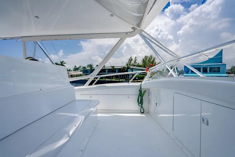Energy Yacht Photos Pics Spacious deck of 1998 Bertram 60 Convertible yacht under clear skies.