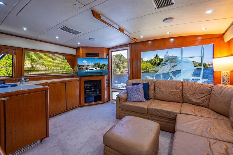 Energy Yacht Photos Pics Luxurious interior of a 1998 Bertram 60 Convertible yacht with leather seating and scenic views.