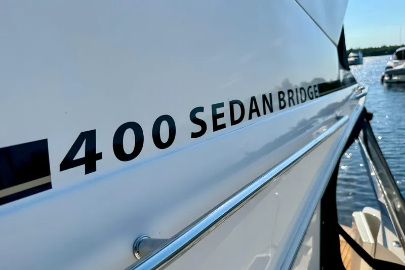 Shaneanigans Yacht Photos Pics Close-up of 1998 Sea Ray 400 Sedan Bridge yacht name on hull.