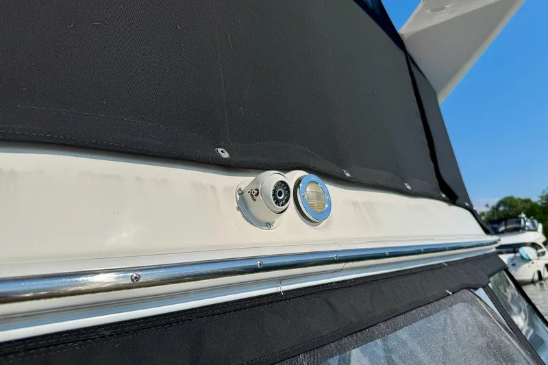 Shaneanigans Yacht Photos Pics 1998 Sea Ray 400 Sedan Bridge, exterior detail with black canvas cover and metal fittings.