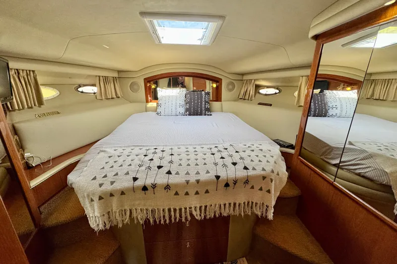 Shaneanigans Yacht Photos Pics Luxurious 1998 Sea Ray 400 Sedan Bridge cabin with cozy bed and elegant decor.