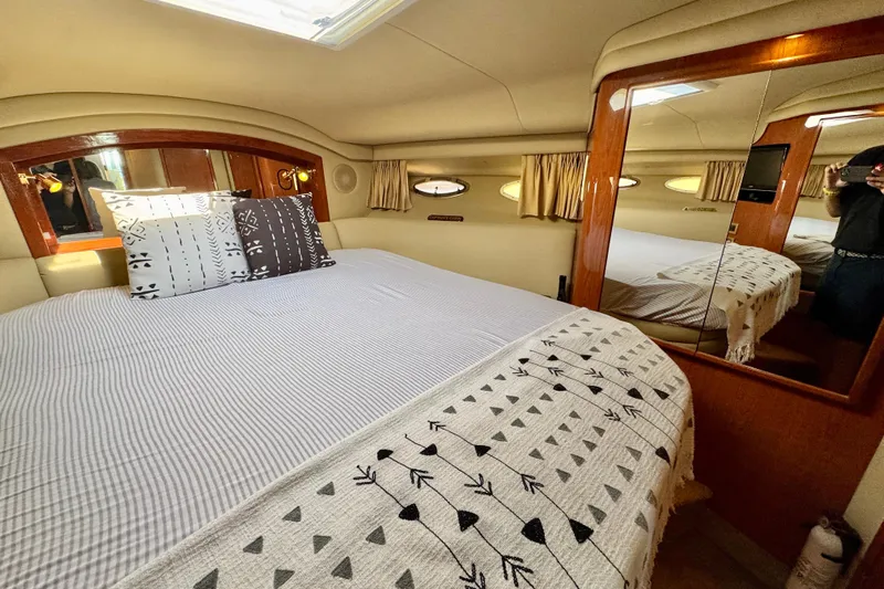 Shaneanigans Yacht Photos Pics Luxurious bedroom interior of 1998 Sea Ray 400 Sedan Bridge yacht.