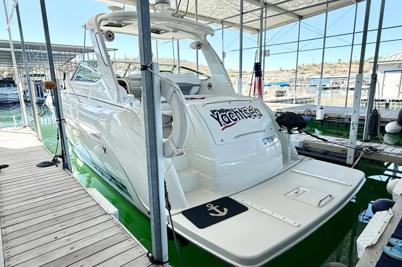 Yachtsea Yacht Photos Pics 2004 Formula 40 Performance Cruiser docked in marina, rear view with "Yachtsea" nameplate.
