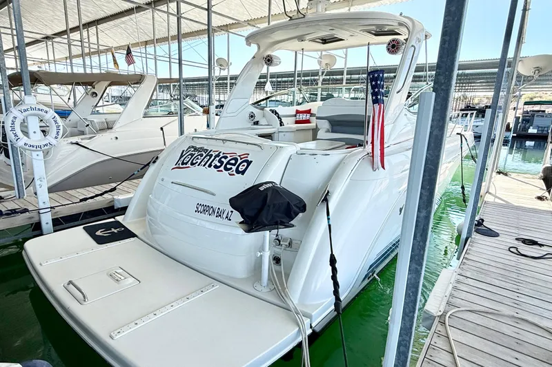 Yachtsea Yacht Photos Pics 2004 Formula 40 Performance Cruiser docked at marina, featuring sleek design and American flag.