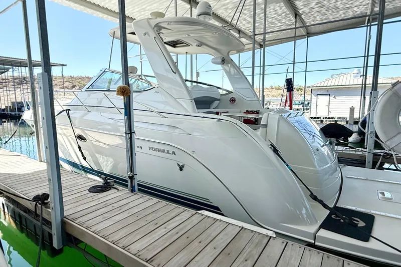Yachtsea Yacht Photos Pics 2004 Formula 40 Performance Cruiser docked in a marina under a covered structure.