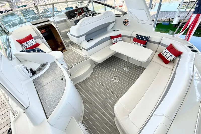 Yachtsea Yacht Photos Pics 2004 Formula 40 Performance Cruiser interior with white seating and nautical-themed cushions.