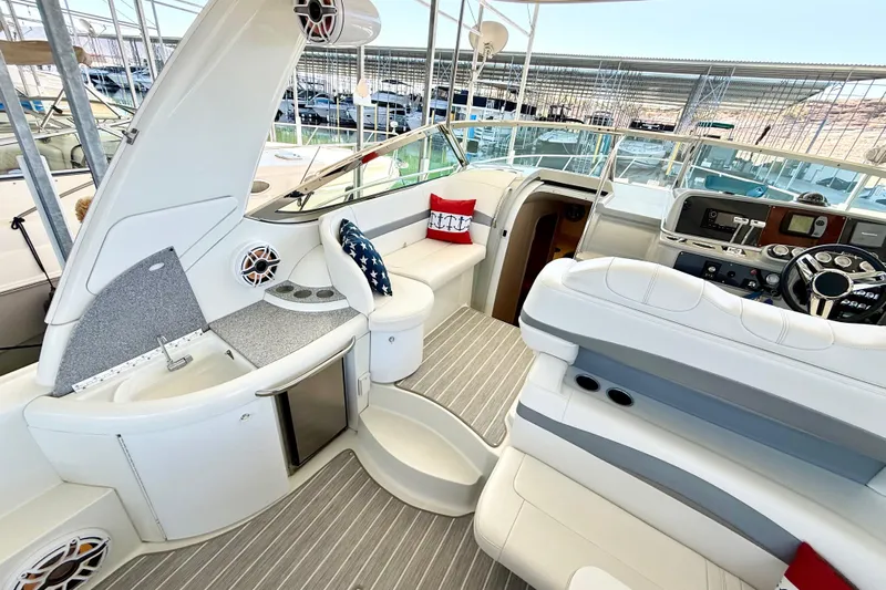 Yachtsea Yacht Photos Pics 2004 Formula 40 Performance Cruiser interior with modern seating and helm, docked in marina.