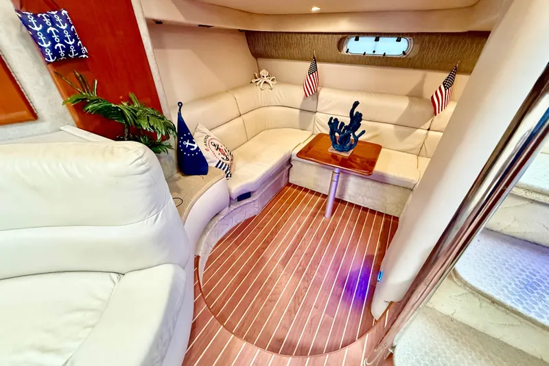 Yachtsea Yacht Photos Pics Luxurious 2004 Formula 40 Performance Cruiser interior with elegant seating and nautical decor.