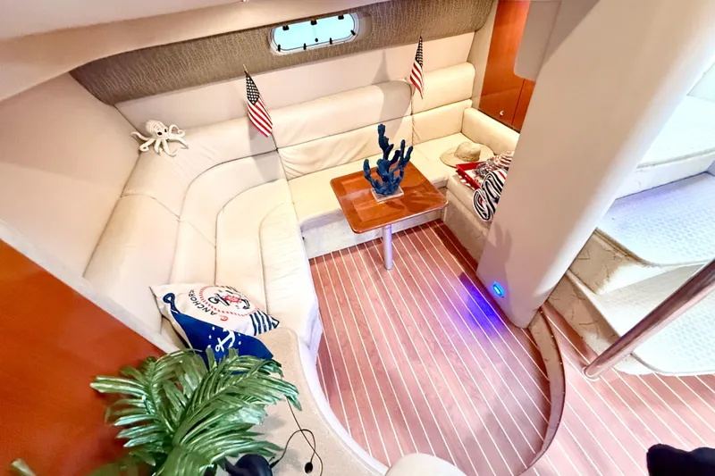 Yachtsea Yacht Photos Pics Luxurious interior of 2004 Formula 40 Performance Cruiser with plush seating and nautical decor.
