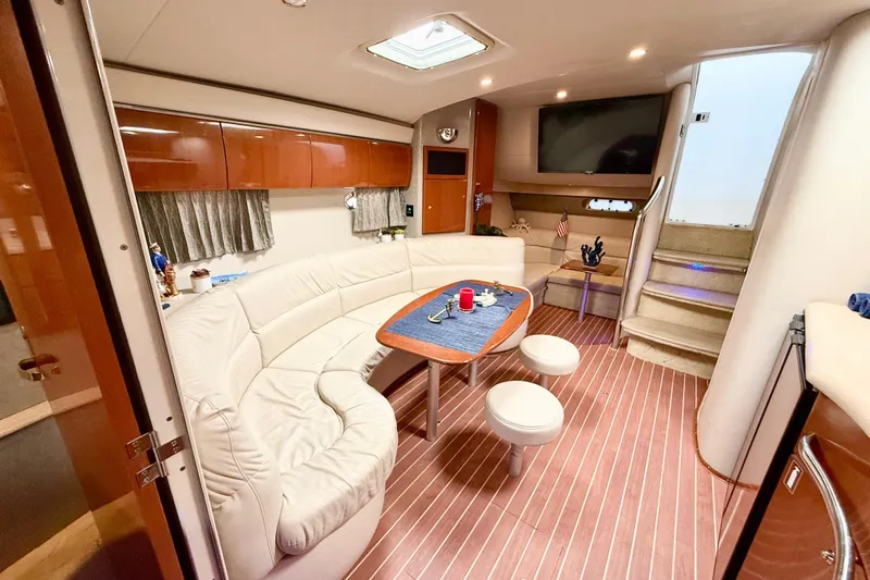 Yachtsea Yacht Photos Pics Luxurious interior of 2004 Formula 40 Performance Cruiser with elegant seating and modern amenities.