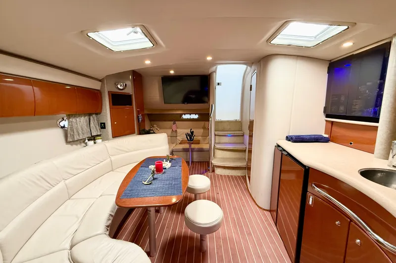 Yachtsea Yacht Photos Pics Luxurious interior of a 2004 Formula 40 Performance Cruiser with elegant seating and modern amenities.